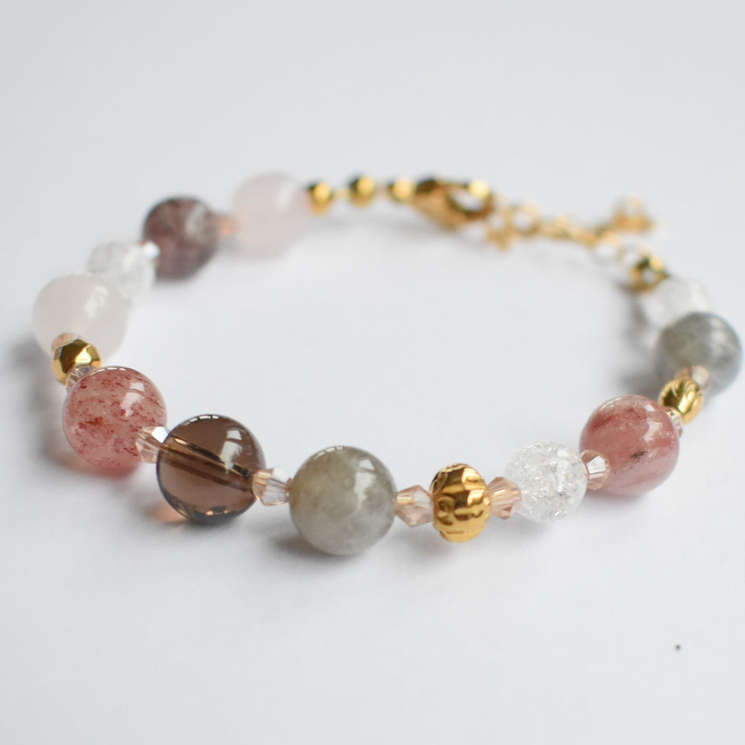 Armbandje met edelstenen en kristal goud